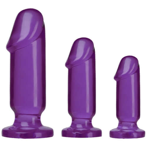 Three purple anal plugs from the Crystal Jellies Anal Starter Kit, showcasing varying sizes for beginners.