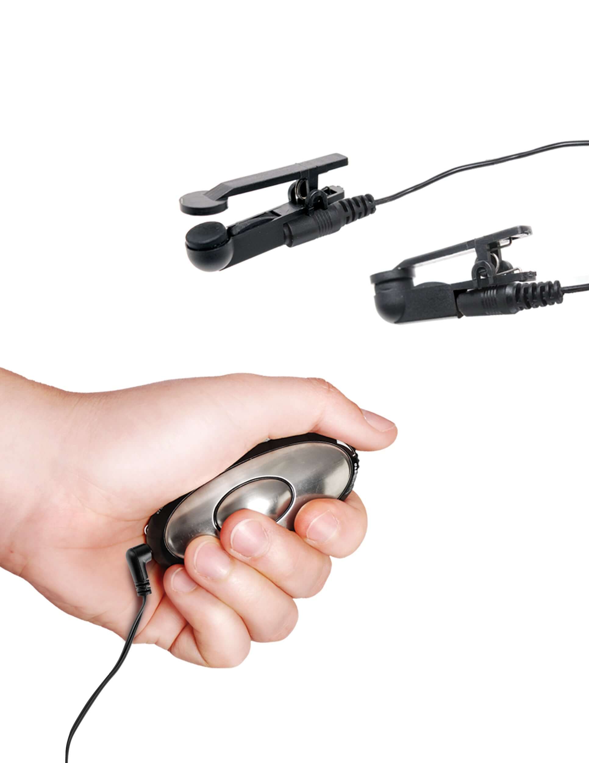hand holding Shock Therapy remote with electric nipple clamps in the background, showcasing electro-stimulation features.