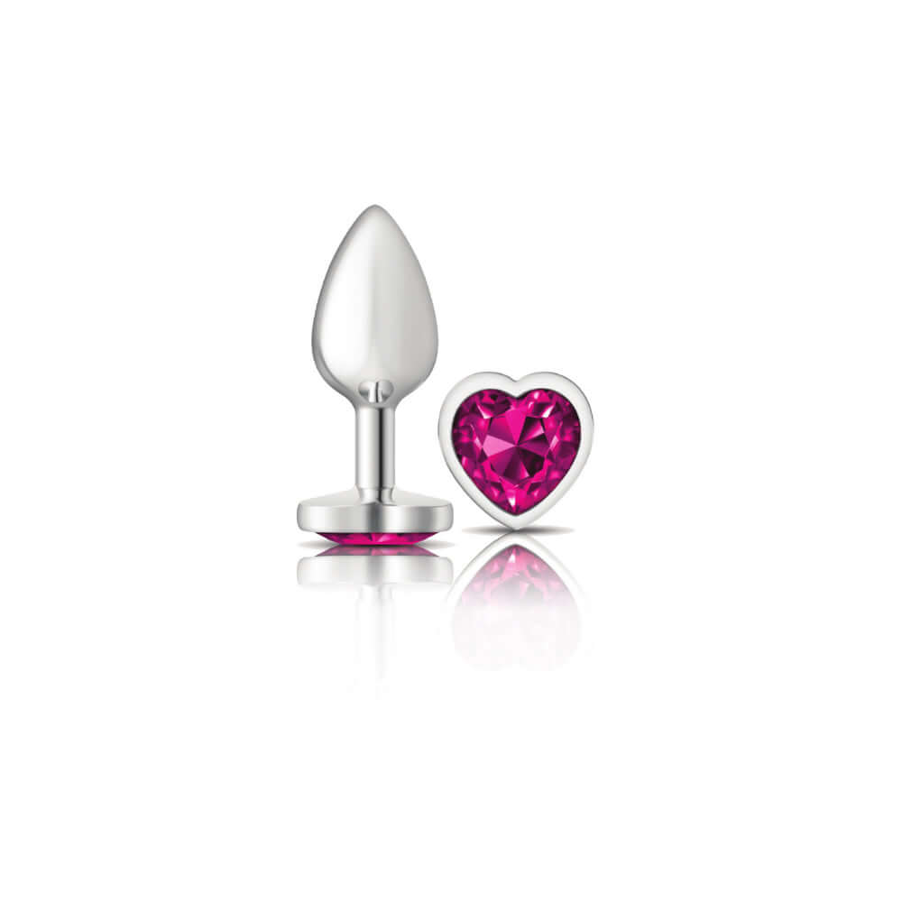 Silver metal butt plug with bright pink heart-shaped gemstone from Cheeky Charms collection, perfect for temperature play.