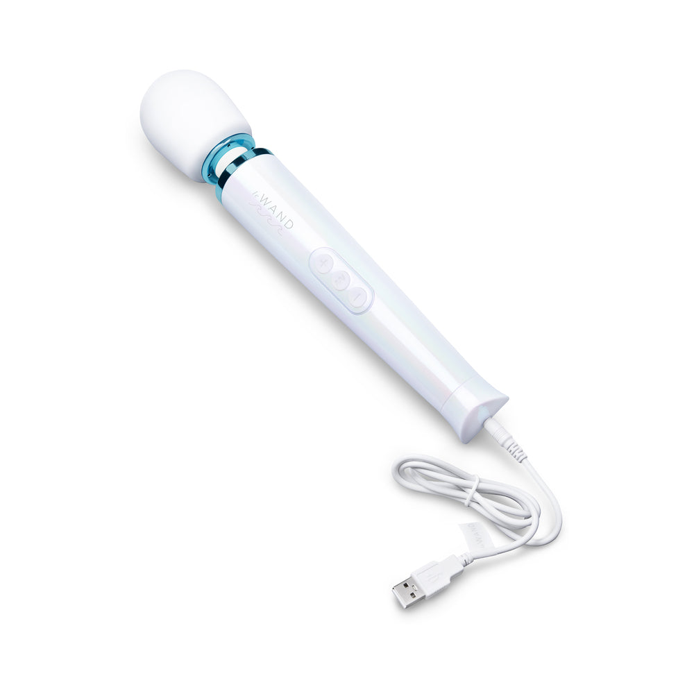 Le Wand Dive Submersible Vibrating Massager Seashell with USB charging cable on a white background.