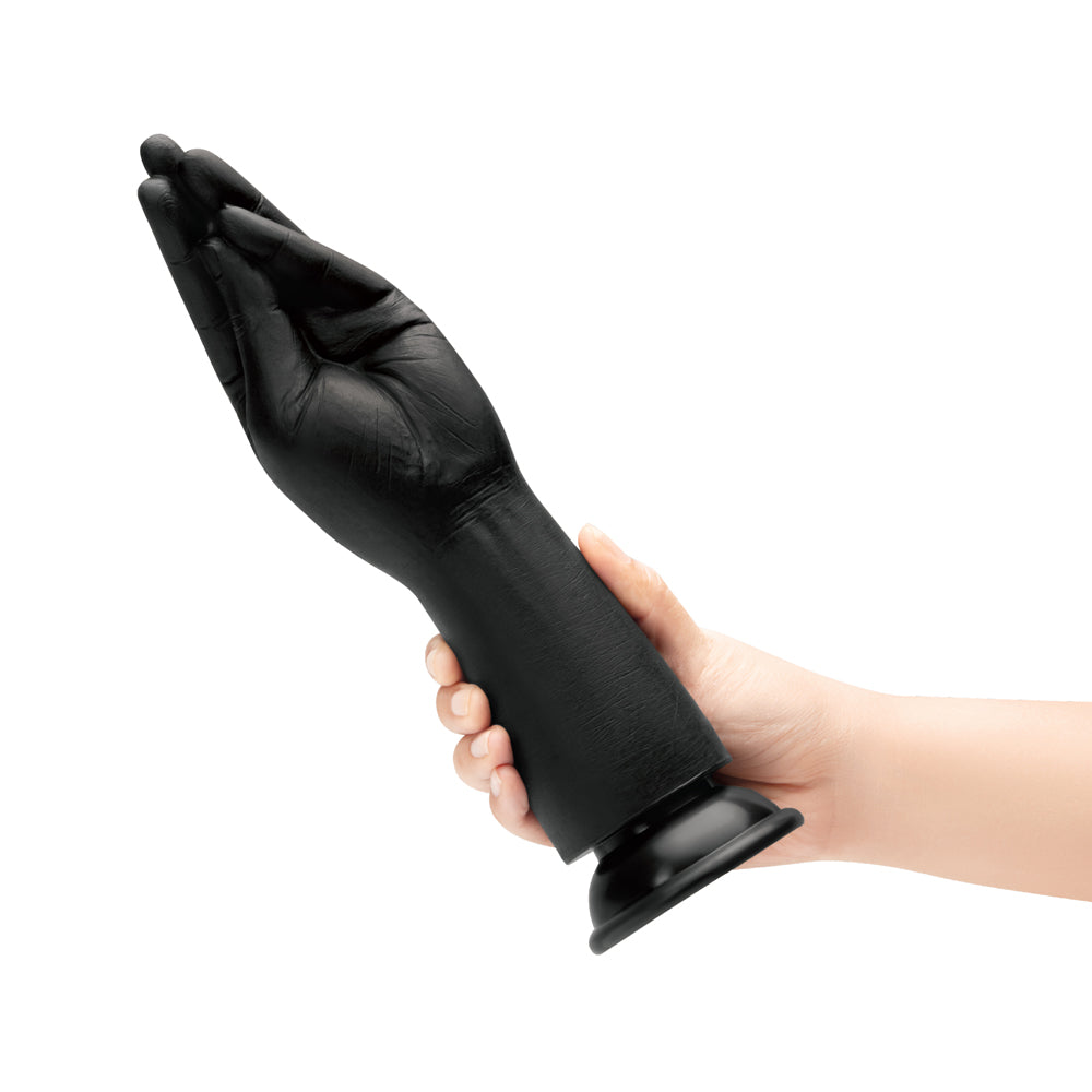 B-vibe Essentials Silicone Hand Fisting Dildo Black in hand, showcasing realistic hand design for intimate exploration.