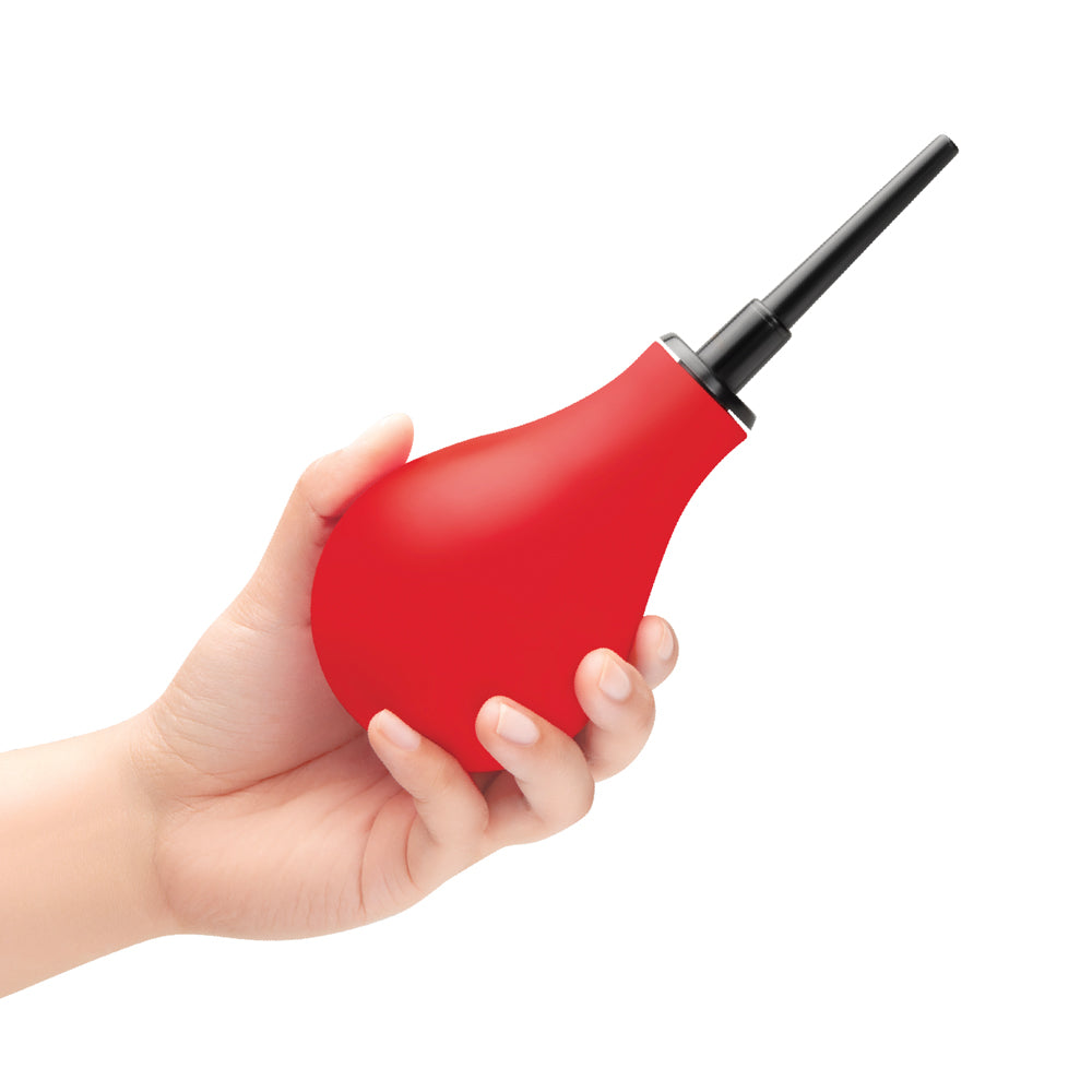 B-Vibe Essentials Hydrobulb Anal Douche 200 ml held in a hand, ideal for pre-anal play hygiene.