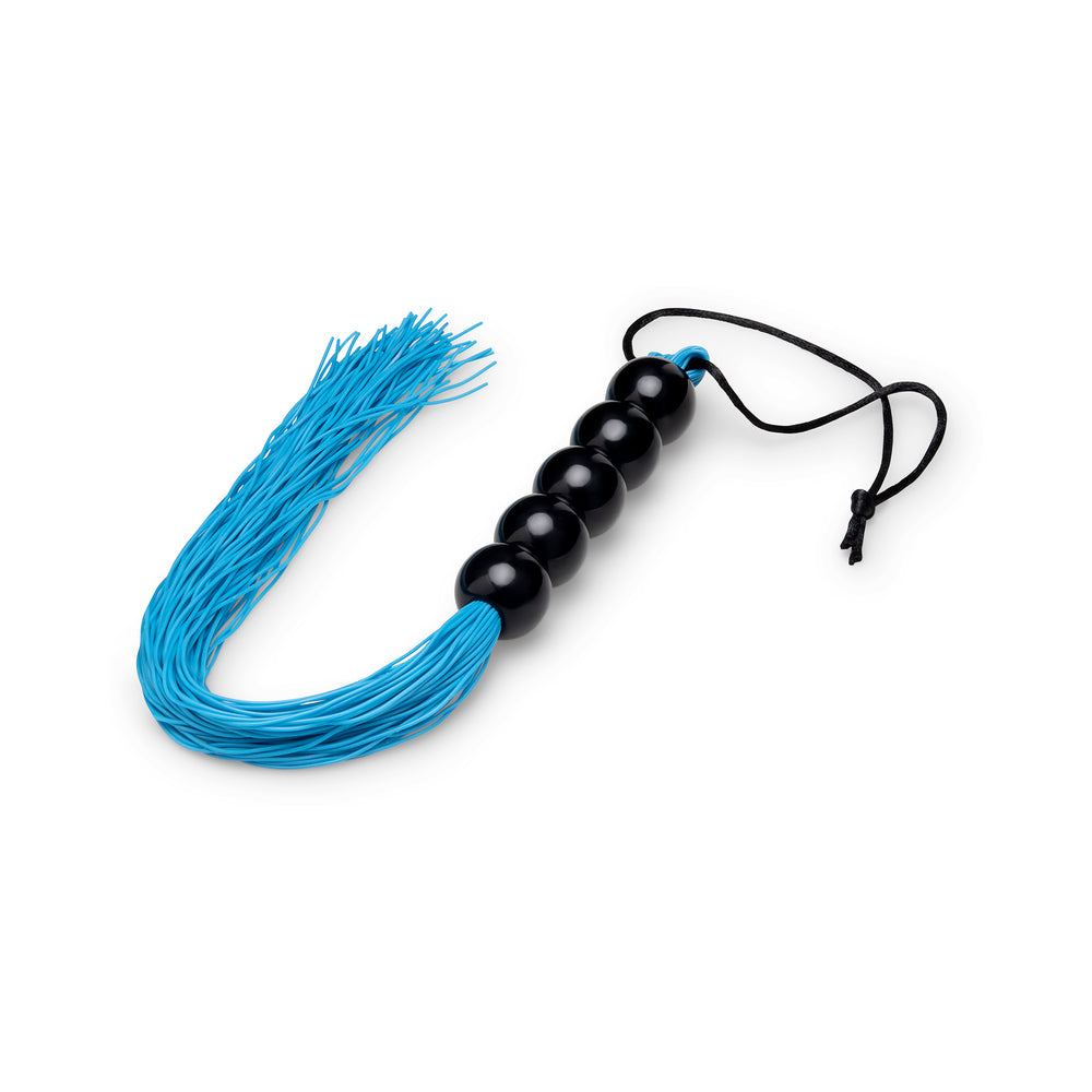 B-vibe Essentials Beaded Flogger featuring a stylish blue fringe and beaded handle for impact play.