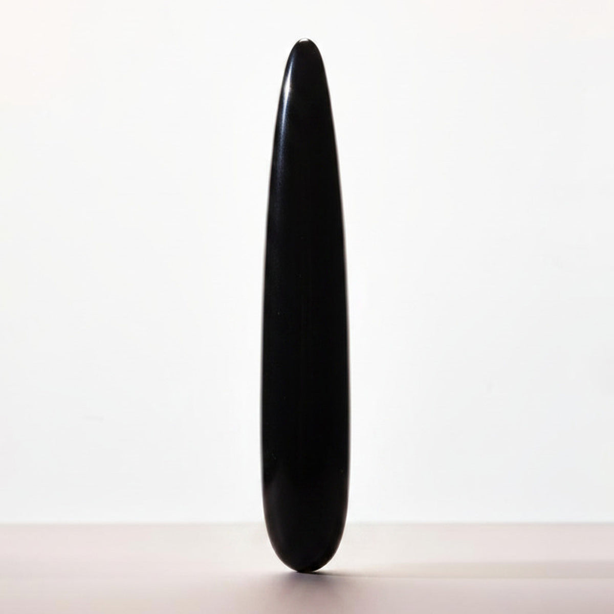Chakrubs Xaga Slim Non-Phallic Dildo in elegant minimalist design, black color, perfect for personal pleasure.