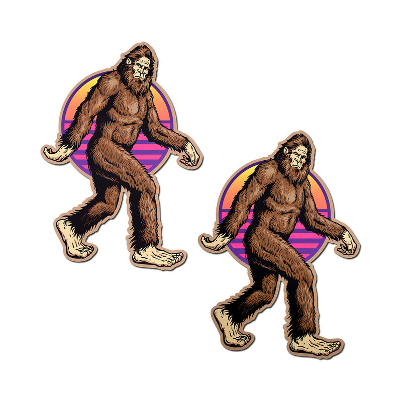 Pastease Sasquatch Bigfoot Pasties featuring a fun Bigfoot design against a retro sunset backdrop.