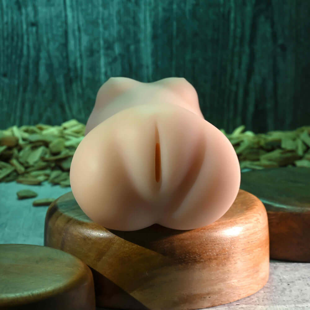 Sasha Grey Movie & Realistic Wet N Ready Stroker displayed on a wooden surface, highlighting its realistic design and texture.