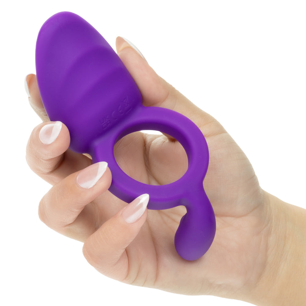 Closer Intimate Rechargeable Ring Passion Purple held in hand, showcasing its sleek design and premium silicone material.