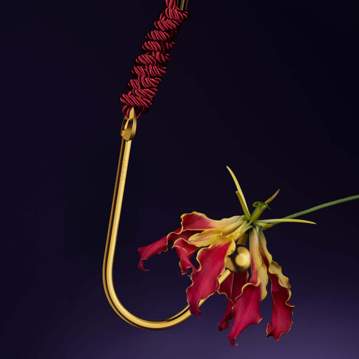 UPKO vaginal/anal hook with a decorative red flower, showcasing its unique design and luxurious finish.