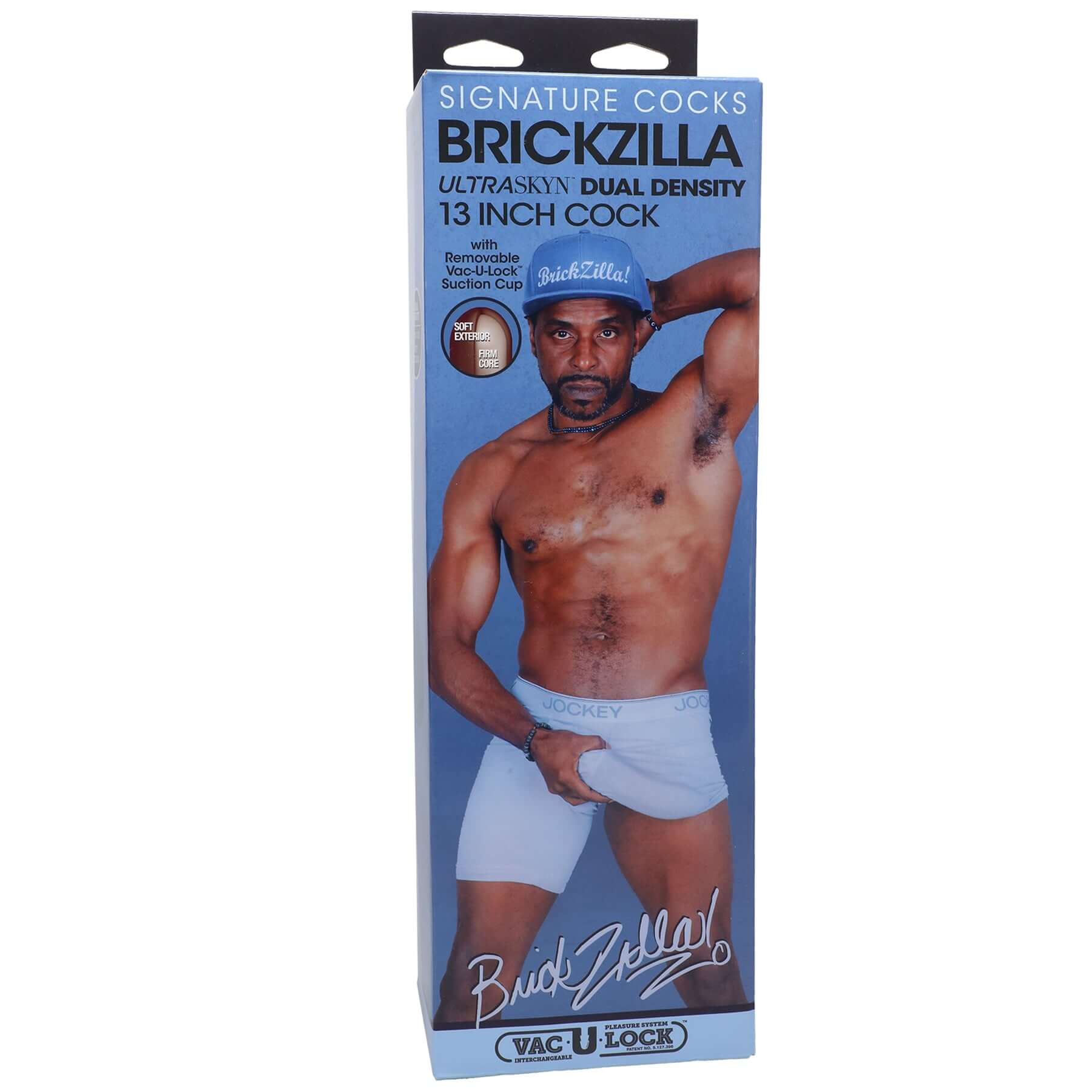 Signature Cocks Brickzilla 13 Inch Ultraskyn Cock Chocolate packaging with model wearing white shorts.