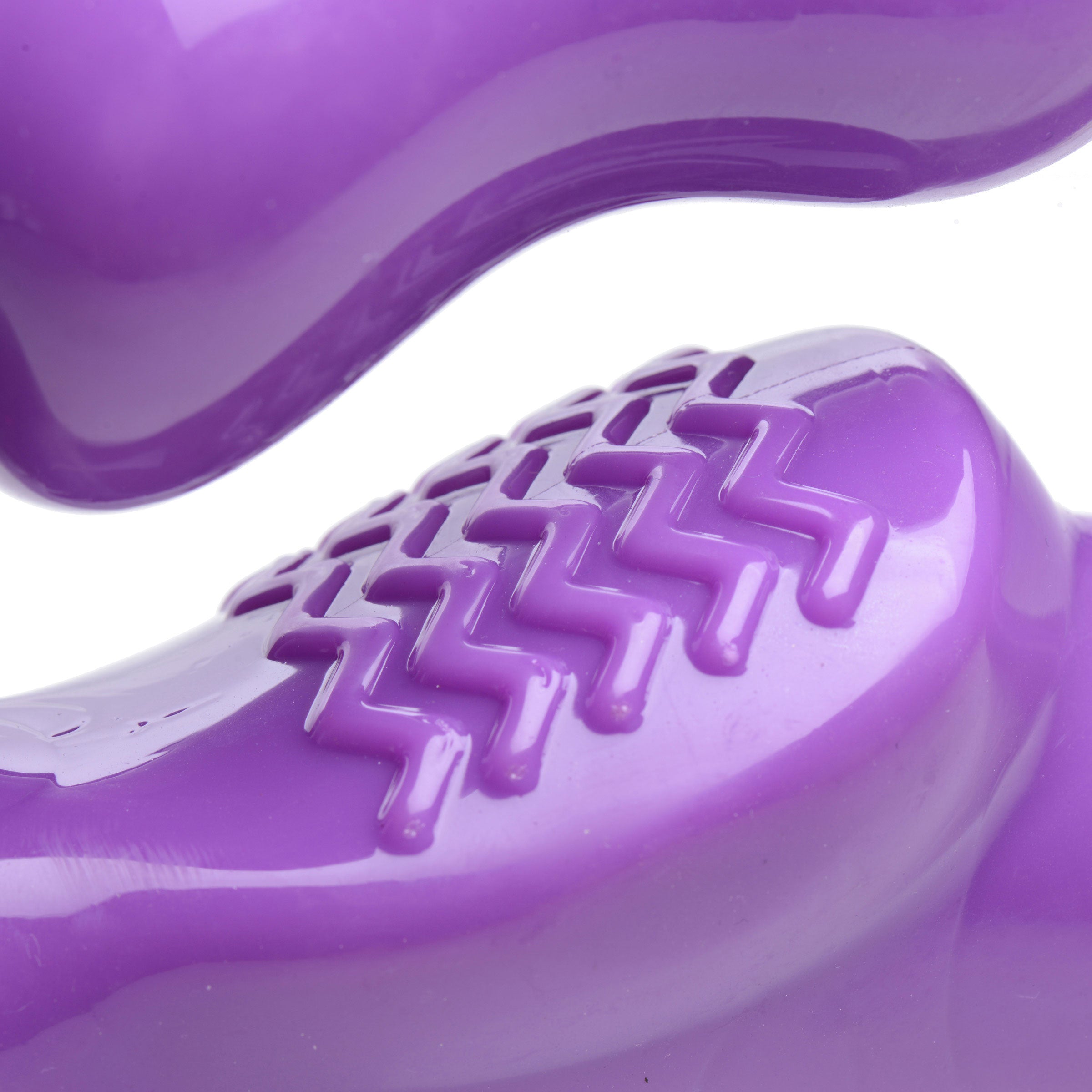Close-up of the Strap U 7X Revolver Thick Vibrating Strapless Strap-On Dildo Purple, showcasing the textured surface.