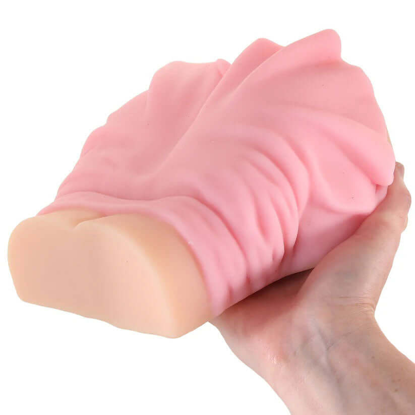 Jillian Janson Pussy & Anus Masturbator Beige held in hand showcasing its realistic design and dual-entry features.