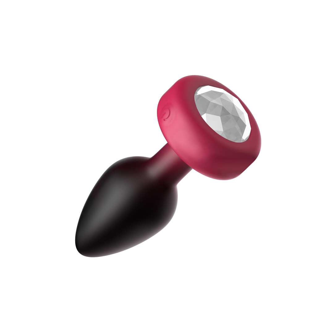 Cheeky Charms Eluxe Vibrating Anal Plug Small Ruby with jeweled base and textured silicone surface.