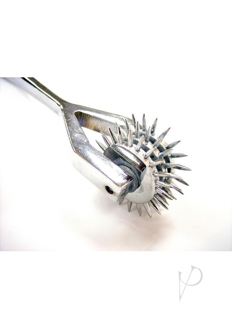 Close-up of the Rouge Triple Stainless Steel Pinwheel Silver, featuring three rotating, spiked heads for sensory stimulation.