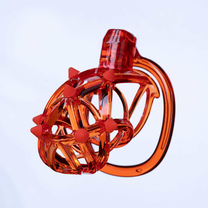UPKO Caged Beast Male Chastity Device Kit in vibrant orange, featuring a unique design inspired by contemporary architecture.
