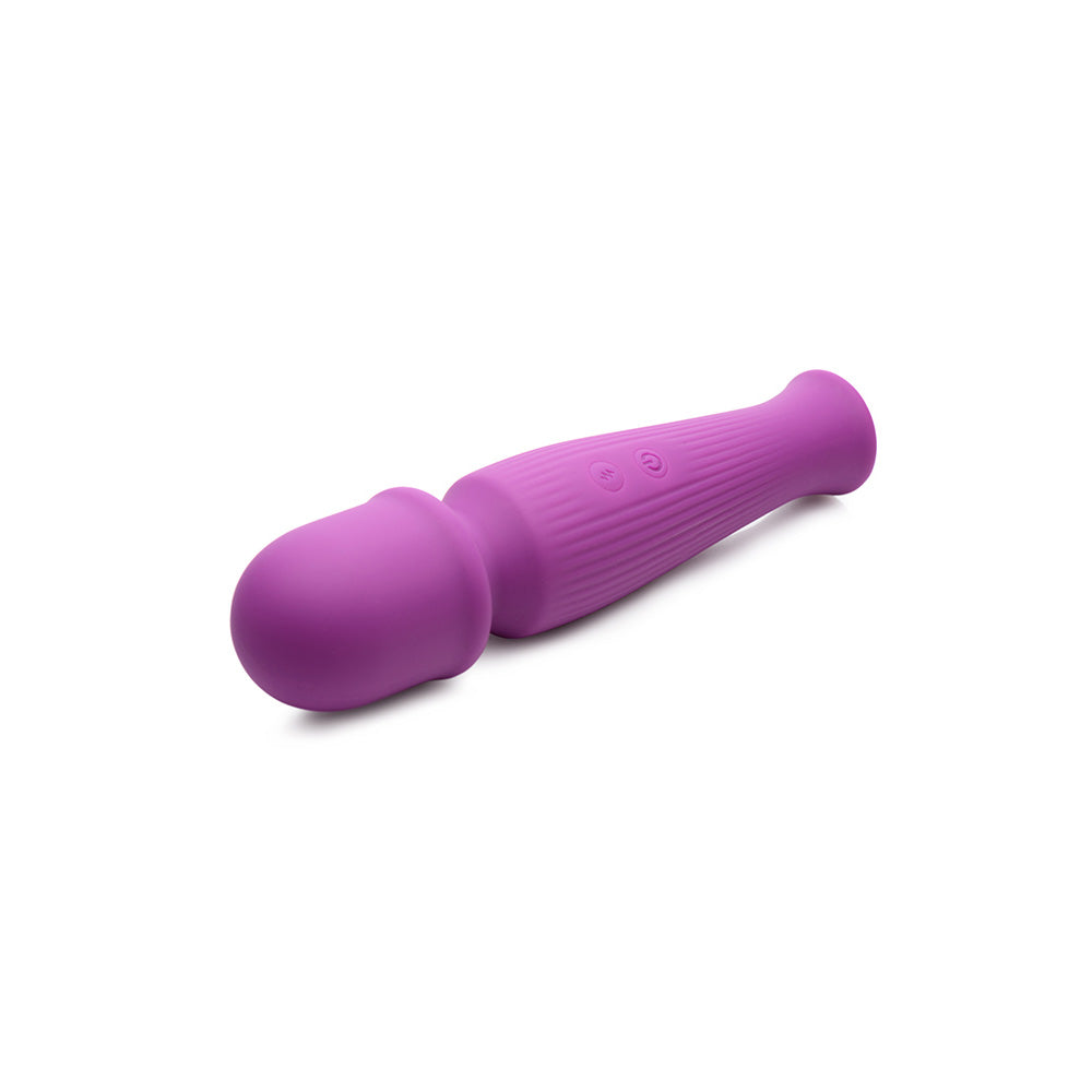 10x Silicone Vibrating Wand Violet resting on a surface, showcasing its ergonomic design and vibrant color.