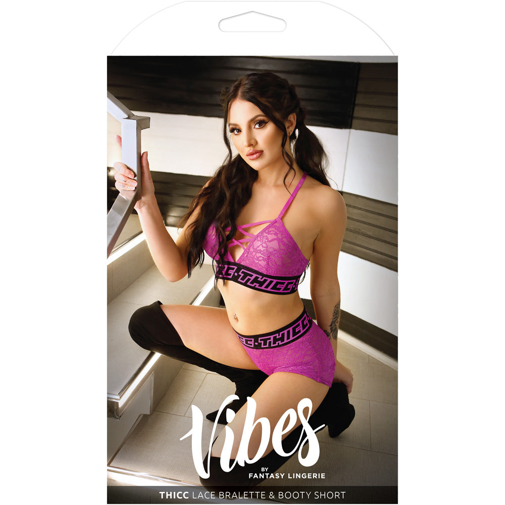 Thicc Lace Bralette and Booty Short Set M/L model showcasing criss-cross neckline and bold elastic waistband.