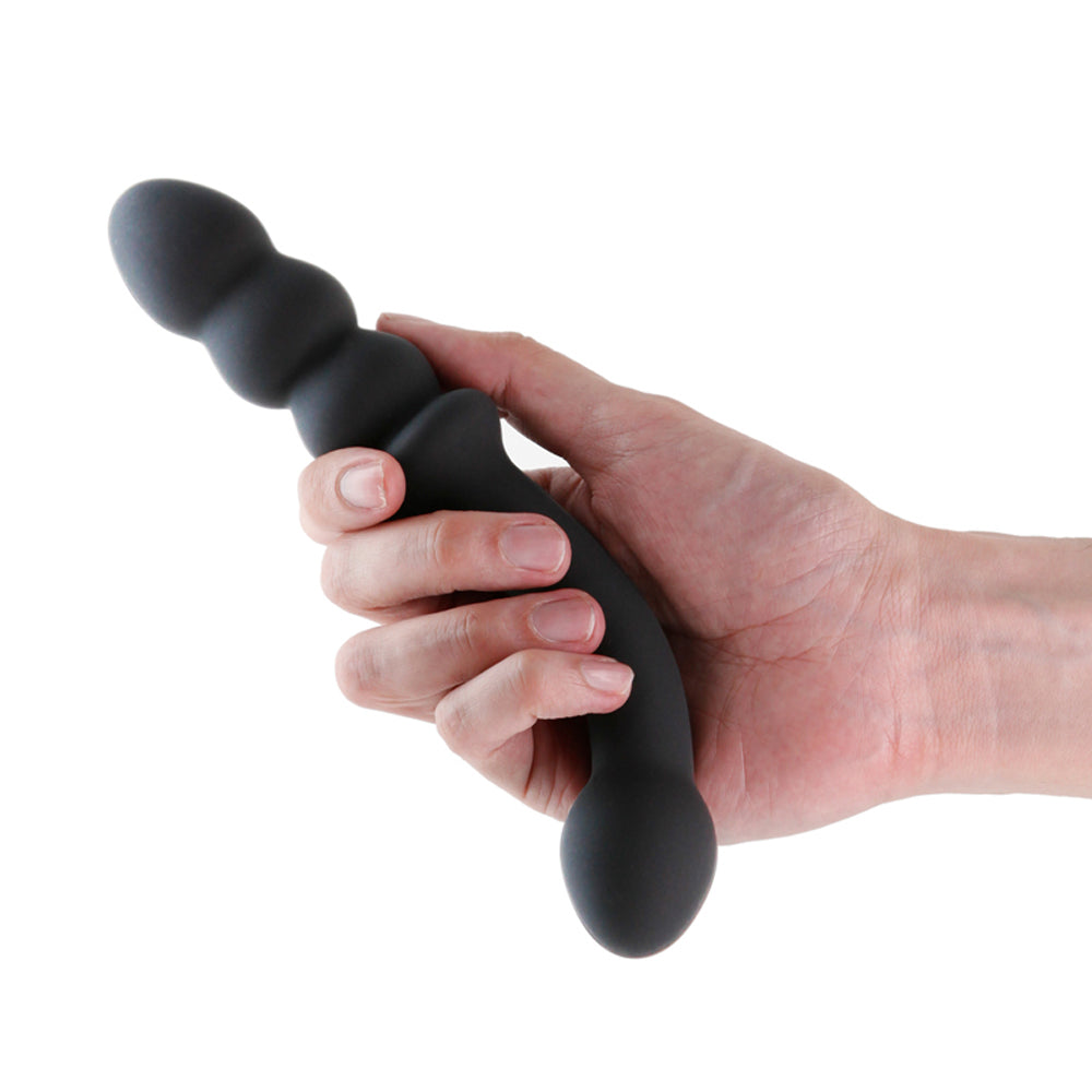 Renegade Duel Dual Ended Anal Bead Vibrator Black held in hand showcasing its sleek design.