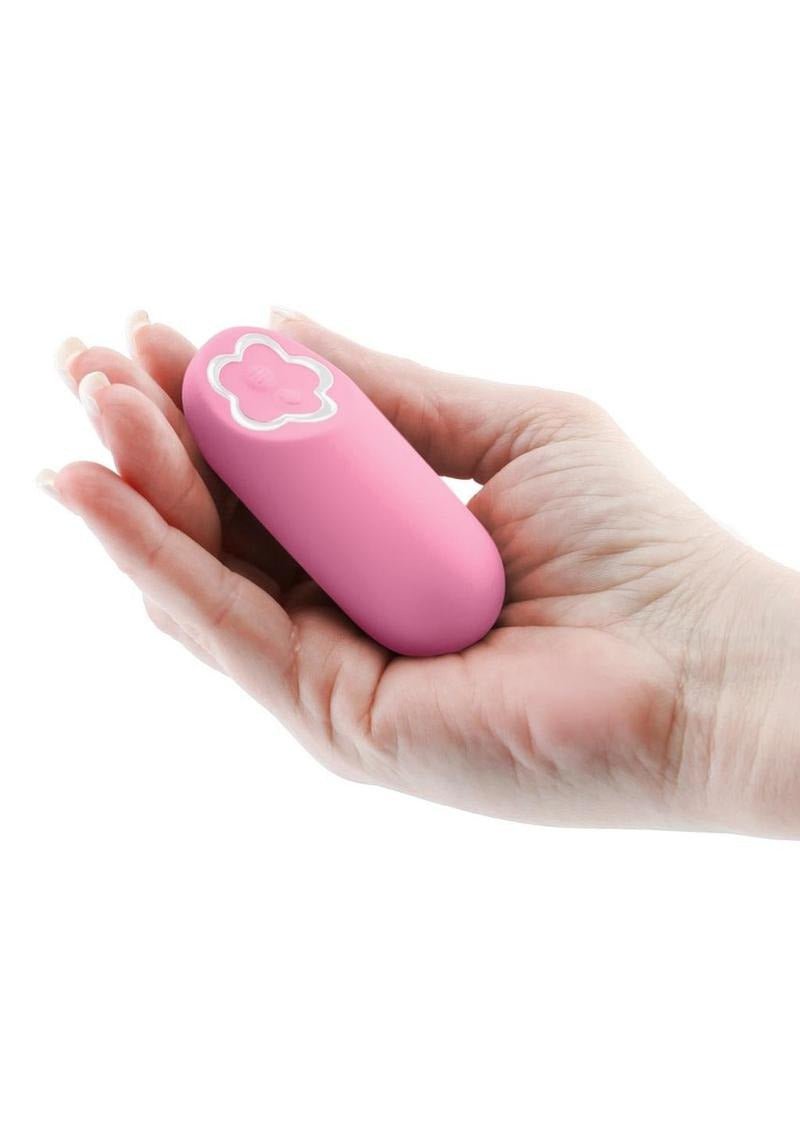 Sugar Pop Harmony Bullet Vibrator Pink held in a hand showcasing its compact design and sleek silicone material.