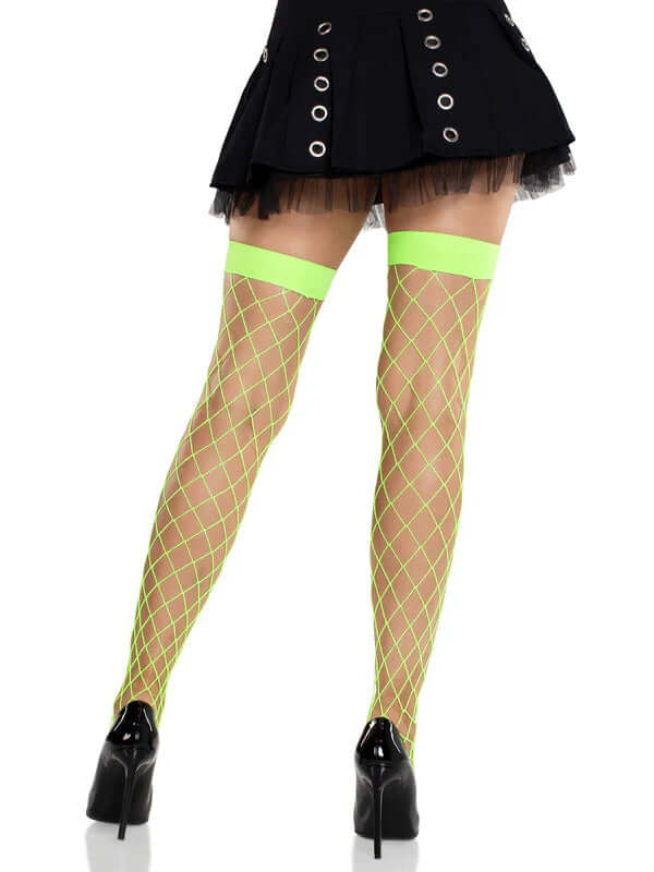 Leg Avenue Ida Net Thigh High Stockings in neon green, featuring a fence net design, worn with a black skirt and heels.