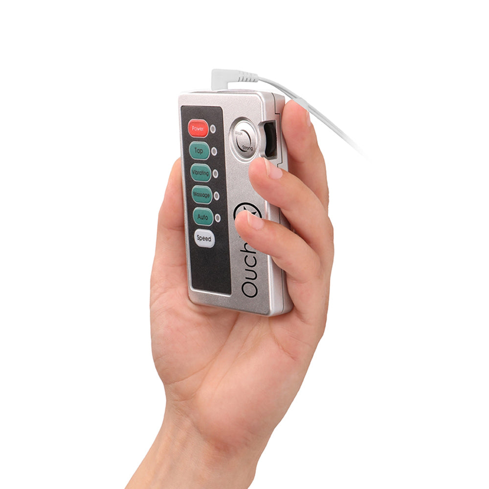 E-stim Urethral Sounding Set Small Silver remote control held in hand, featuring various stimulation settings.