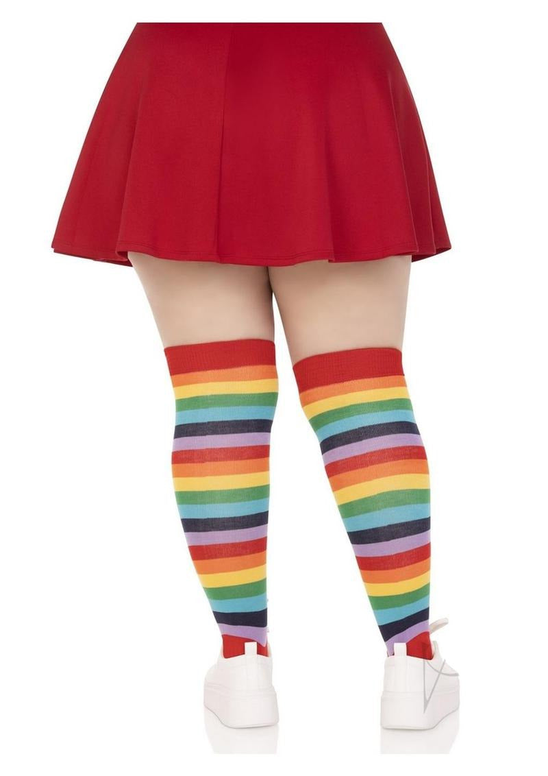 Leg Avenue Lycra Acrylic Rainbow Thigh High 1X 2X showcased with a red skirt, featuring vibrant rainbow stripes.