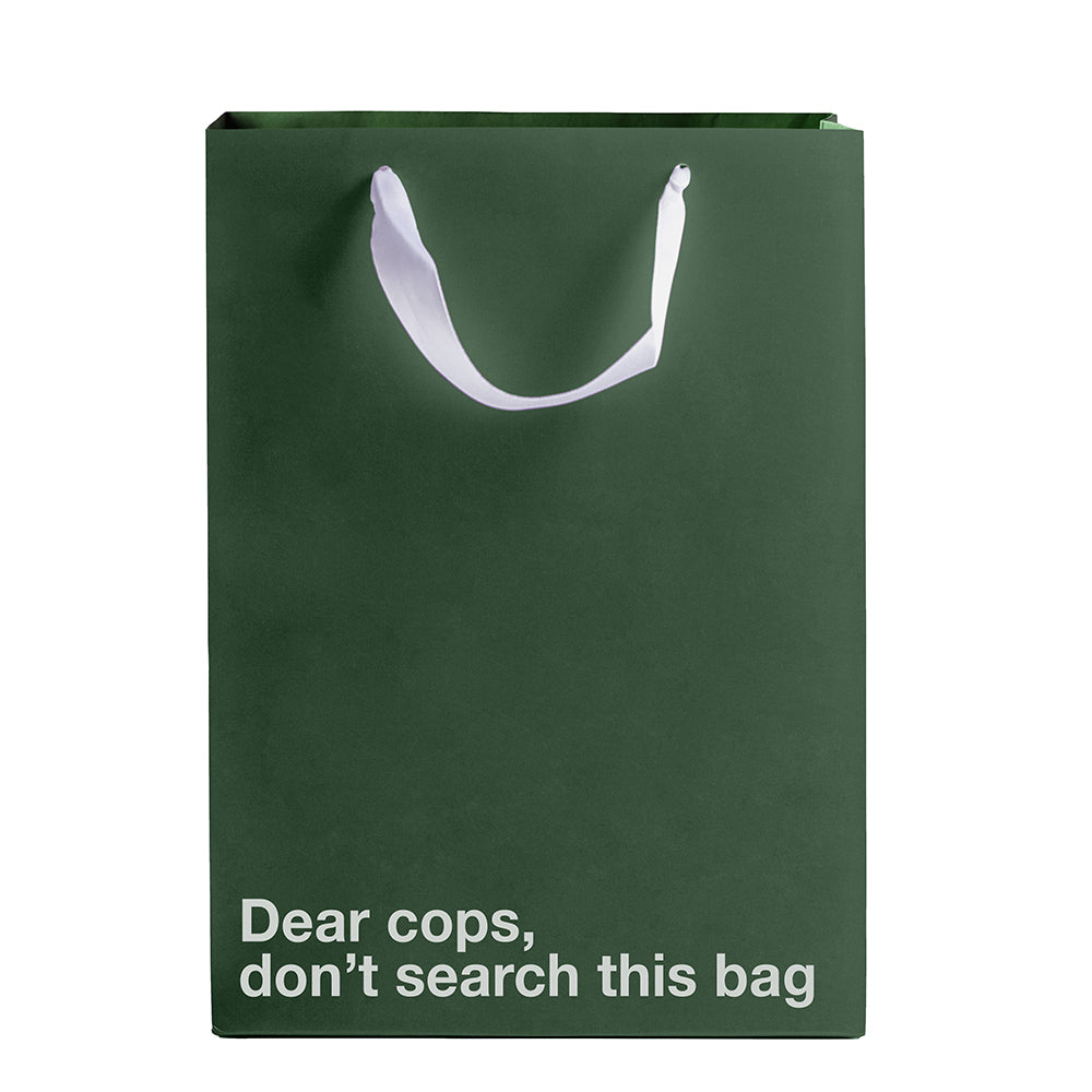 Wood Rocket Dear Cops Don't Search This Gift Bag, green Kraft paper gift bag with white ribbon handle and humorous text.