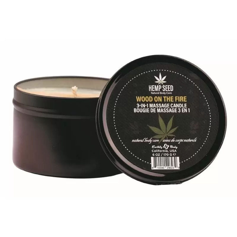 Hemp Seed 3-in-1 Holiday Candle Wood On The Fire 6 Oz in a sleek black tin with a candle wick visible.