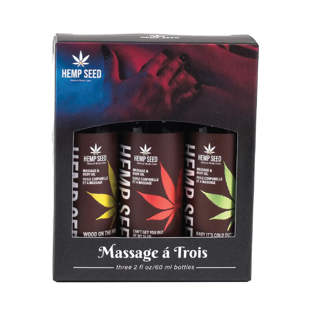 Earthly Body Hemp Seed Massage Oil Gift Set Holiday 2023 featuring three festive scented oils in a gift box.