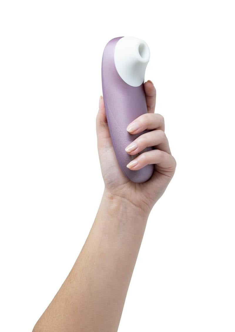 Womanizer Pro Air Pulse Clitoral Vibrator Lavender held in hand, showcasing its ergonomic design and soft color.