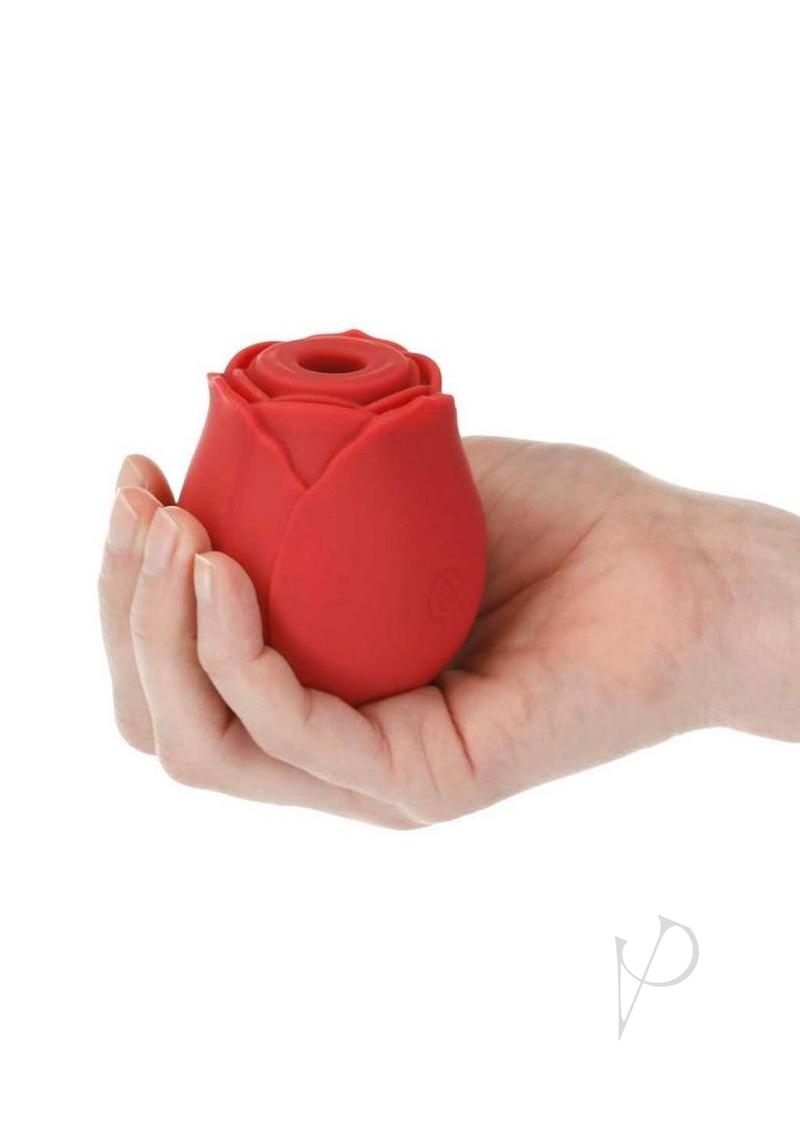 M`Lady Rose Silicone Clitoral Suction Stimulator Red held in a hand for targeted clitoral play.