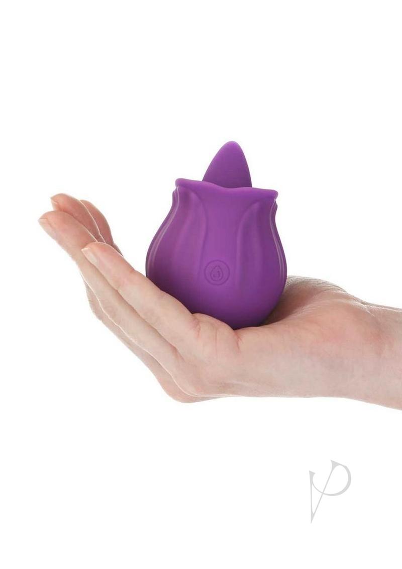M'Lady Rose Flickering Tongue Clitoral Stimulator Purple held in a hand showing its discreet design.