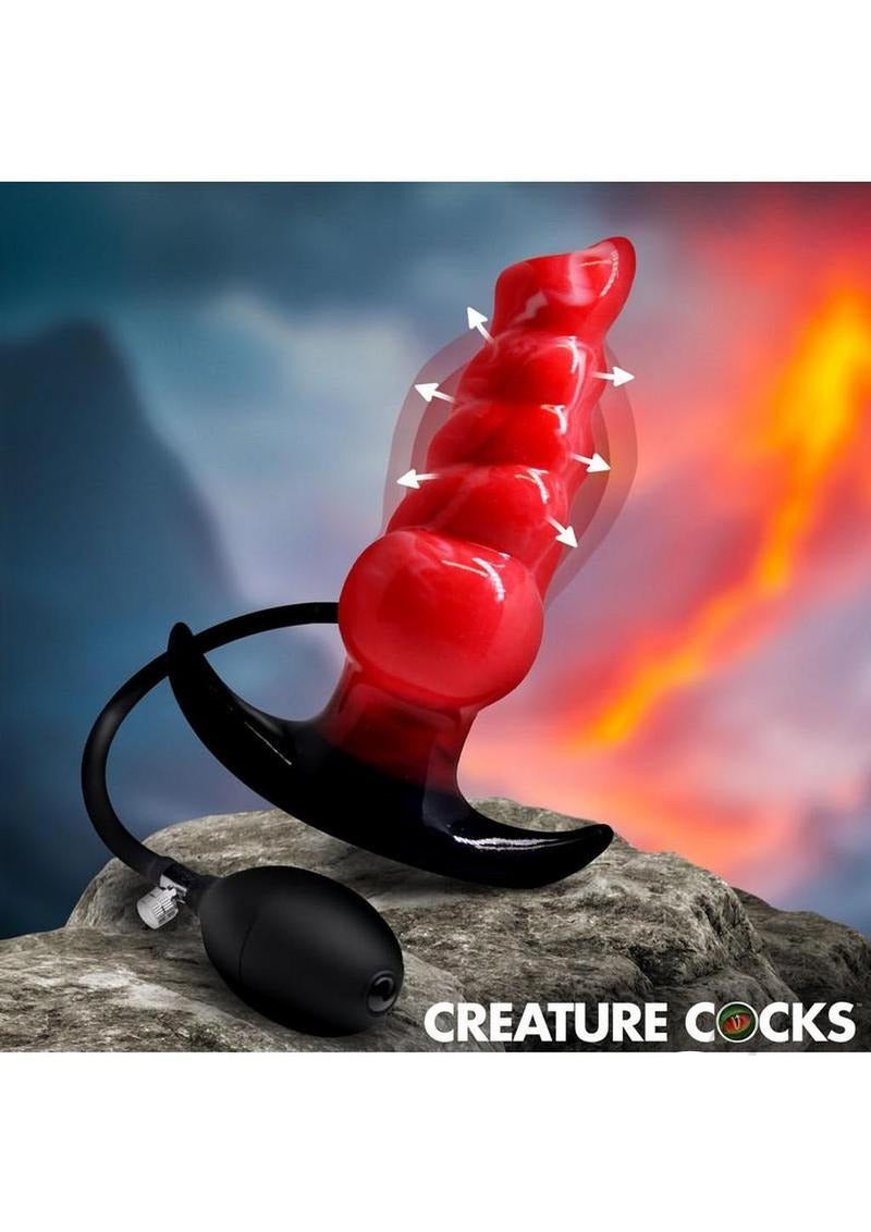 Creature Cocks Blaze Inflatable Silicone Anal Plug with customizable expansion on a rocky background.