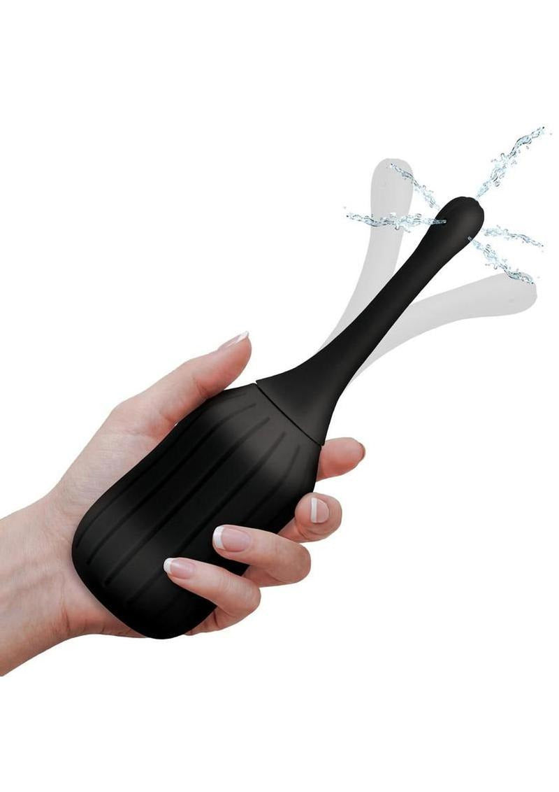 CleanStream Silicone Enema Bulb with Poseable Nozzle being used, demonstrating its spray functionality.