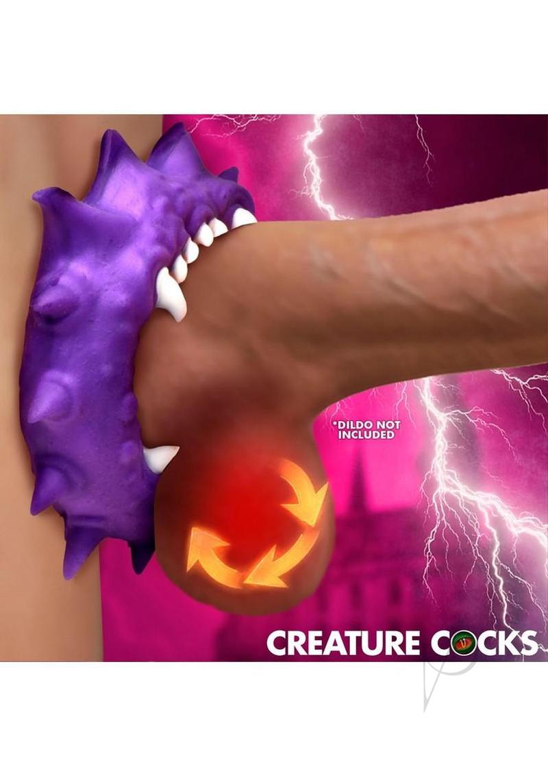 Creature Cock Constrictor Silicone Cock Ring Purple showcased on a penis with dramatic spikes and fangs.