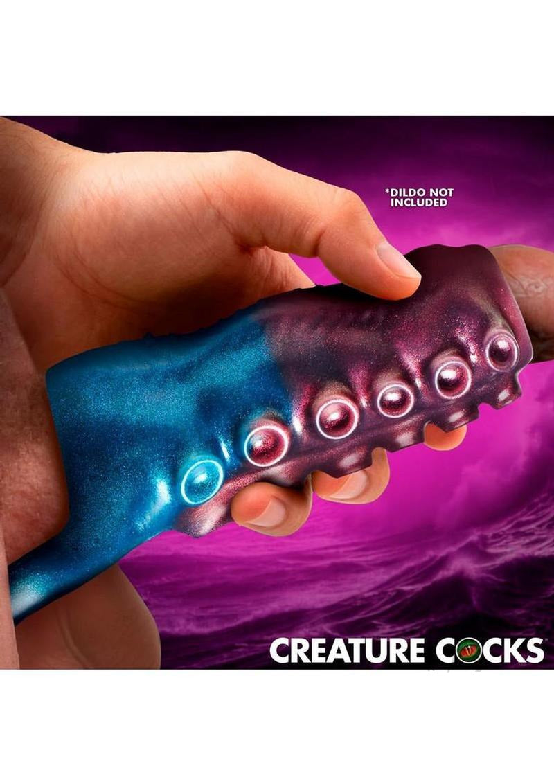 Creature Cock Tentagirth Tentacle Silicone Penis Enhancer in hand with marbled blue and pink colors.