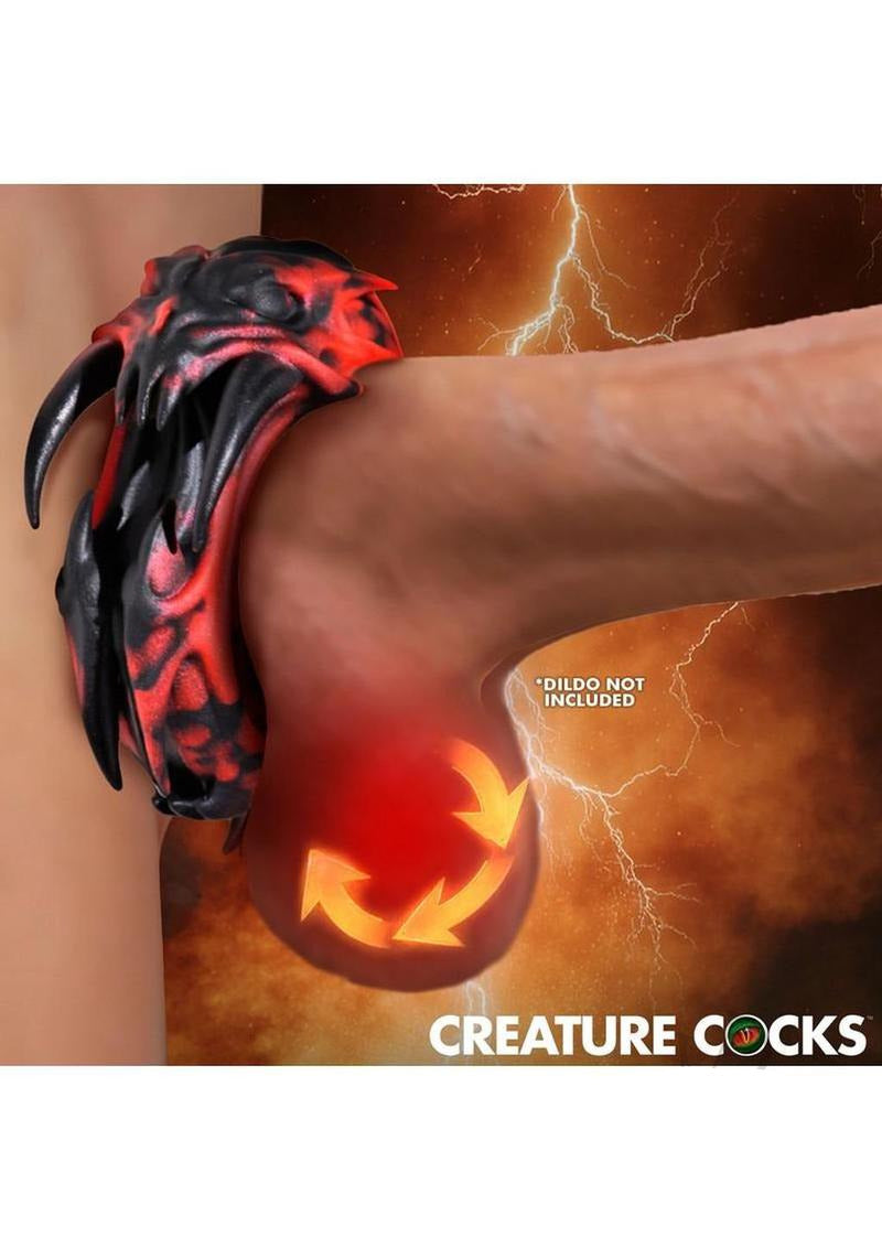 Creature Cock Hell Fang Silicone Cock Ring with demonic design and crimson-black marbled finish on display.