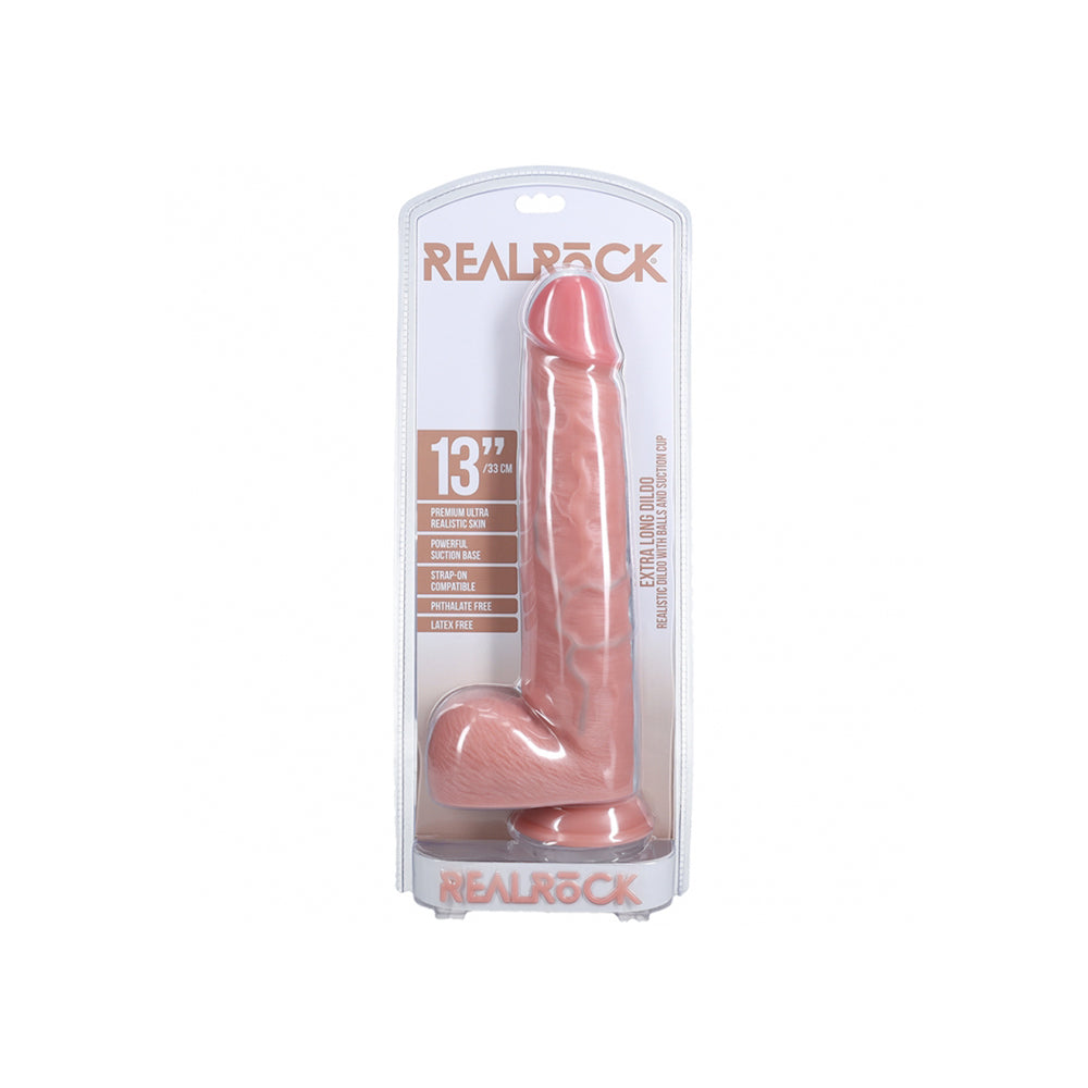 Realrock Extra Long Realistic Dildo With Balls 13 inch Flesh in packaging, lifelike design and durable material.