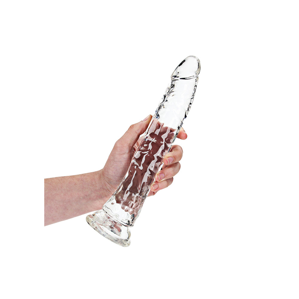 Realrock Crystal Clear 10 Inch Slim Dildo Transparent held in hand, showcasing its sleek and transparent design.