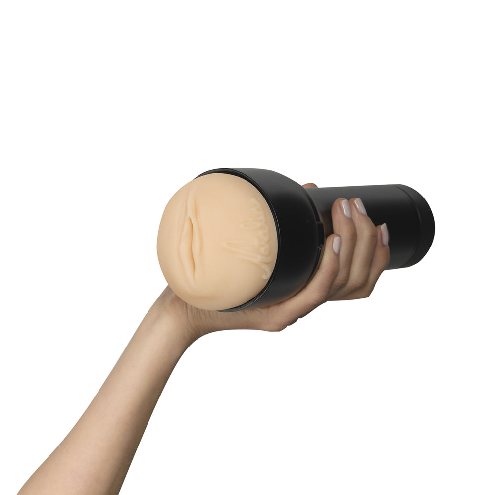 Feel Natalia Starr Stroker By Kiiroo in a hand showcasing real-life experience.