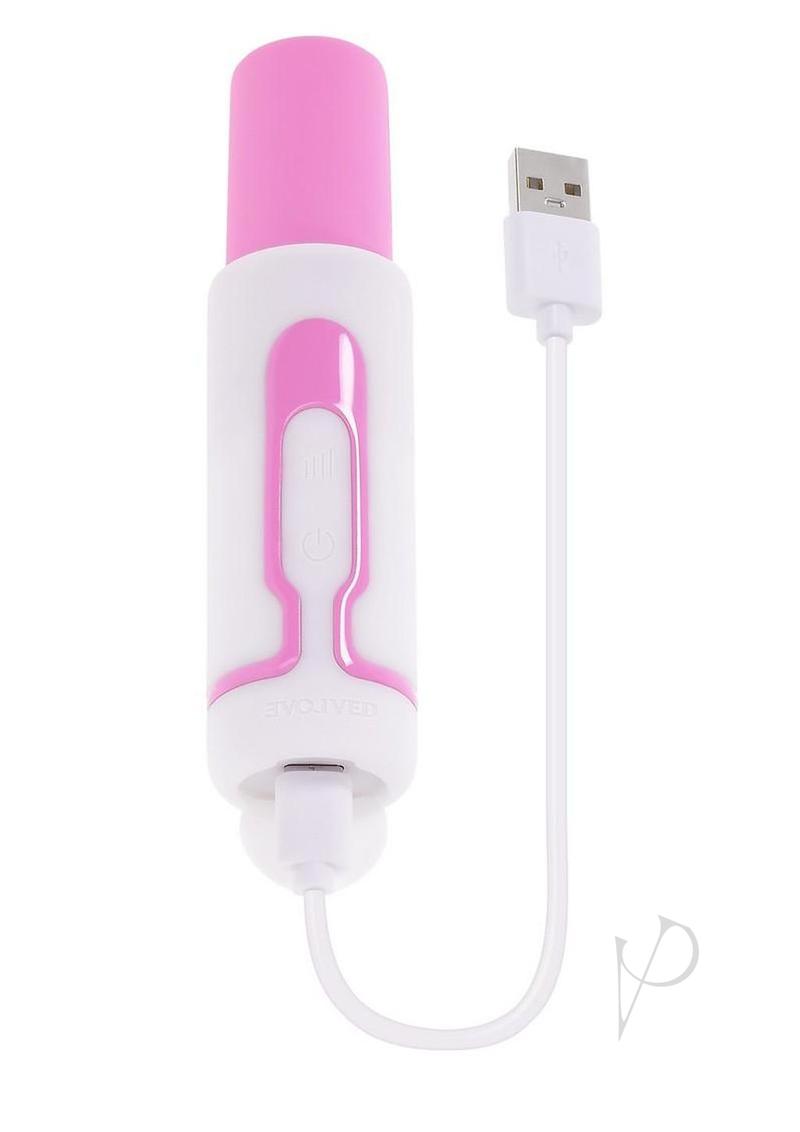 Evolved Pucker Up Lipstick Vibe Silicone Bullet Pink White charging with USB cable, chic design, and unique stimulation.