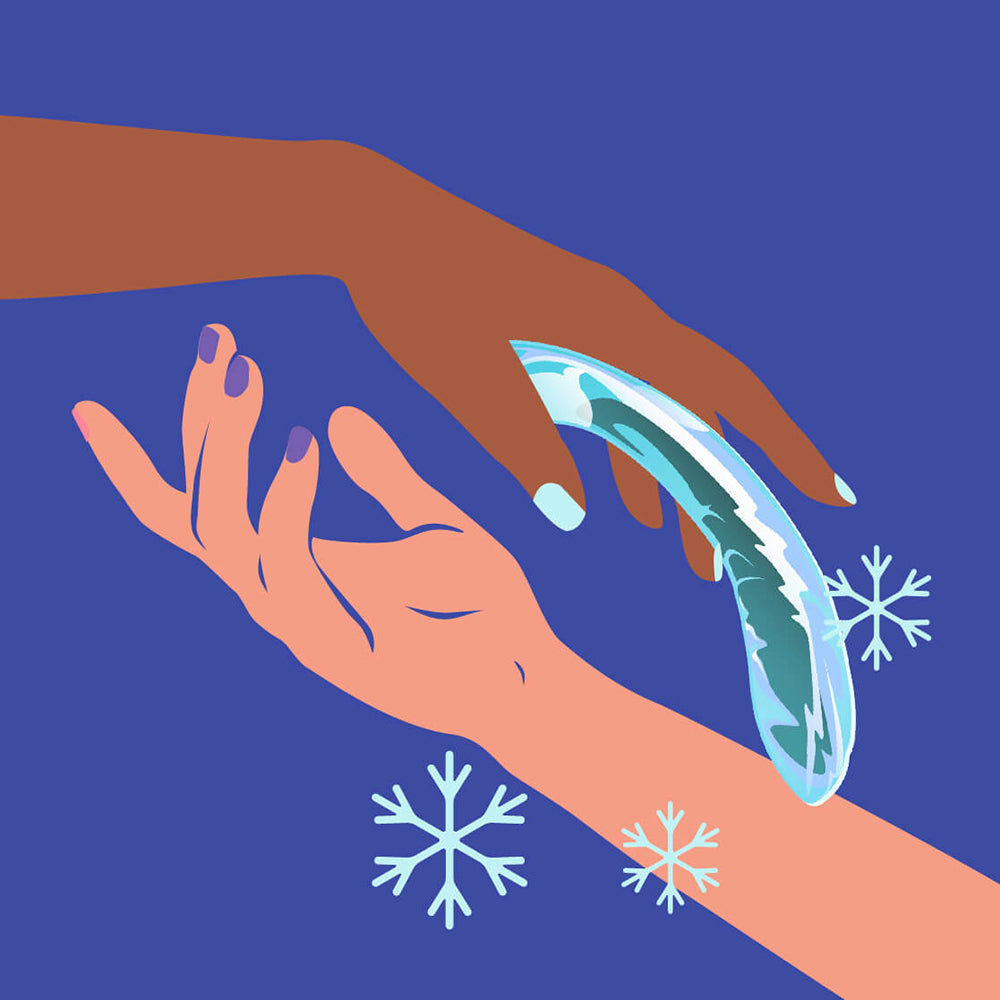 Biird Kalii Glass G-spot Dildo Teal being held between two hands with a blue background and snowflakes.