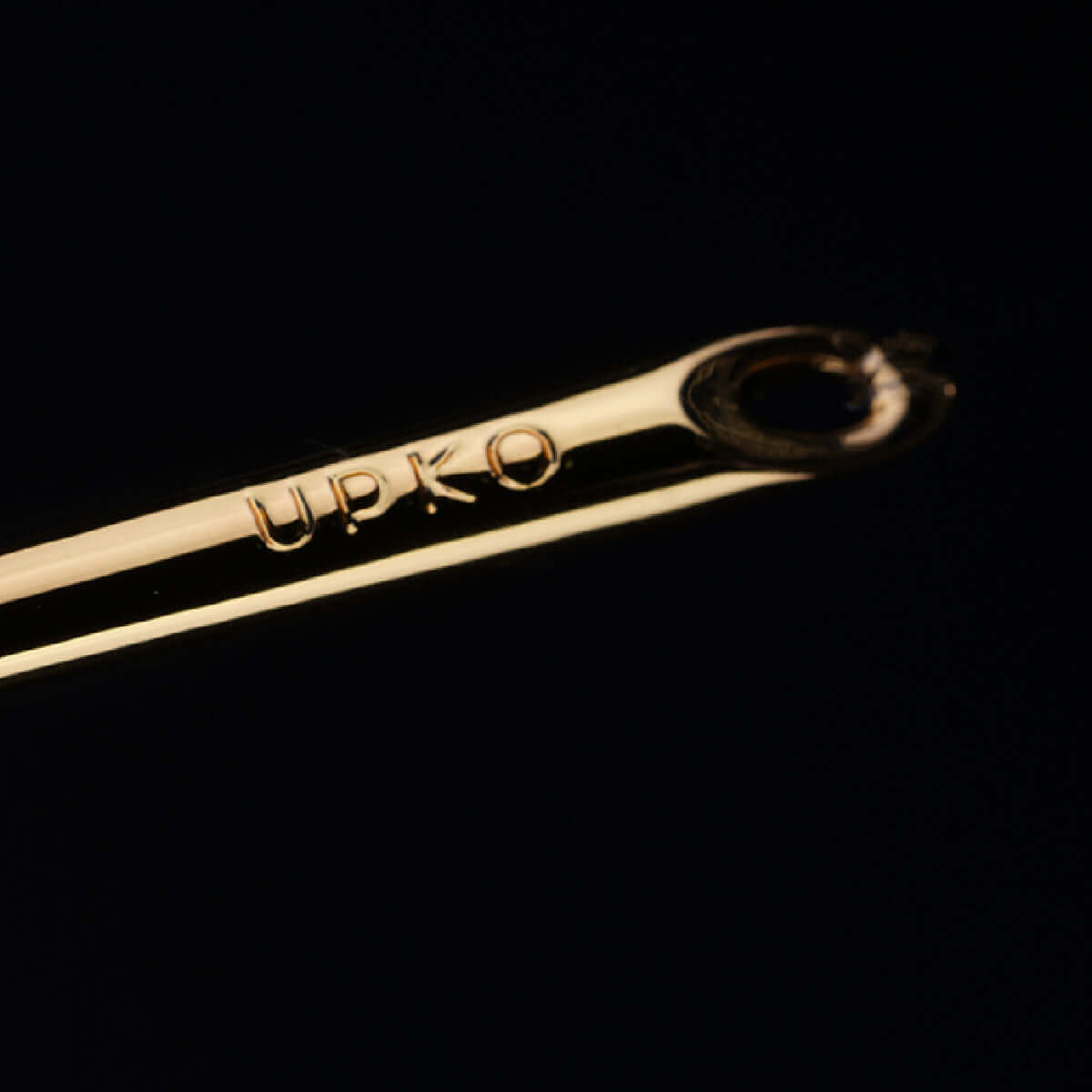 UPKO candle wax scraper with a sleek gold design, ideal for cleaning solidified wax during playful moments.