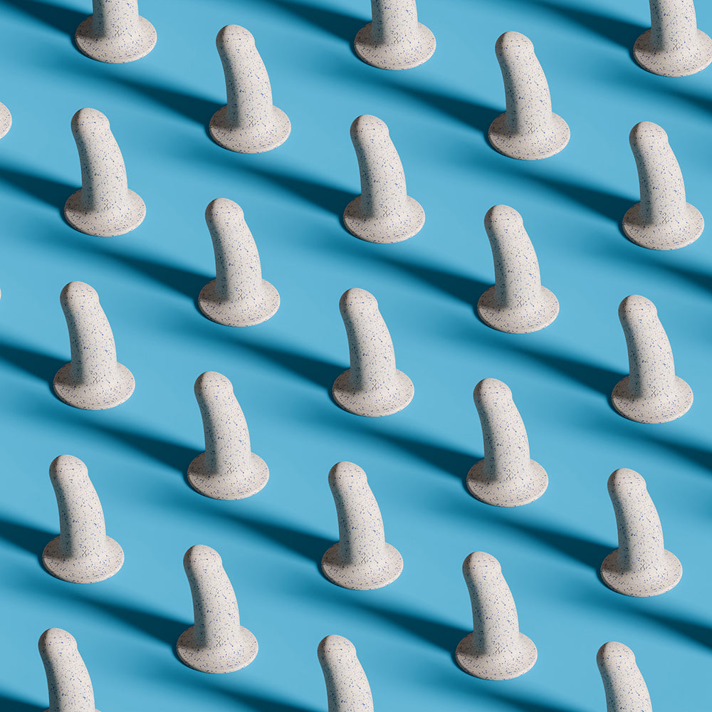 Biird Boo 5.5 Inch Soft Silicone Suction Cup Dildo Blue displayed in a repeating pattern on a blue background.