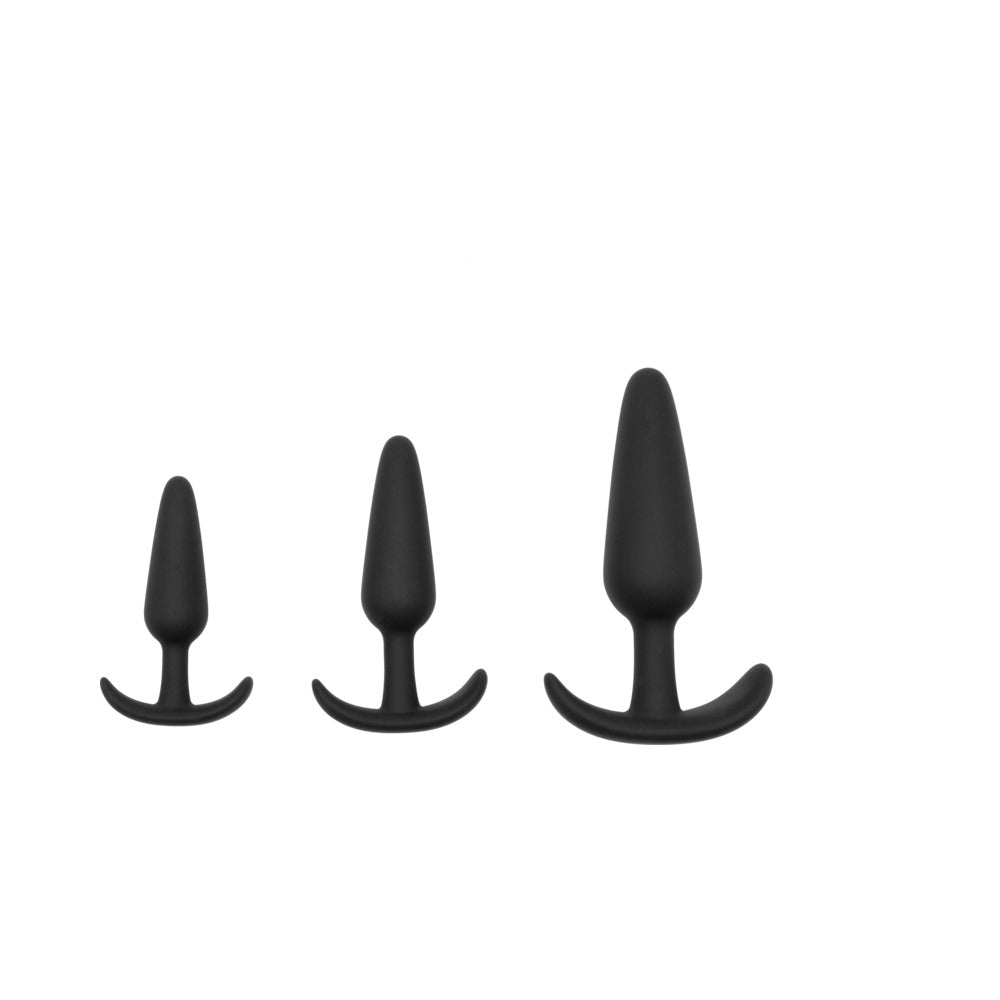 Adam & Eve Naughty Silicone Anal Trainer Kit Black featuring three graduated black butt plugs for beginner-friendly anal play.