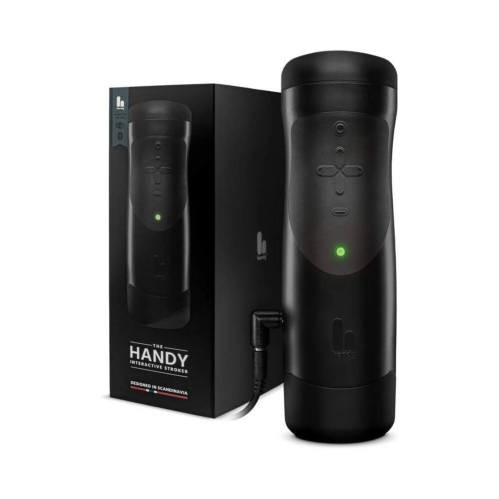 The Handy Interactive Stroker Black alongside its stylish packaging showcasing advanced features and design.