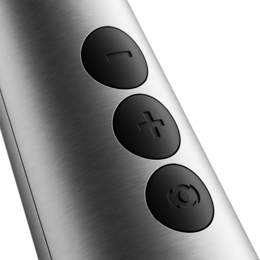 Doxy Die Cast Max Plug-in Wand Massager Silver control buttons close-up on a sleek metallic surface.