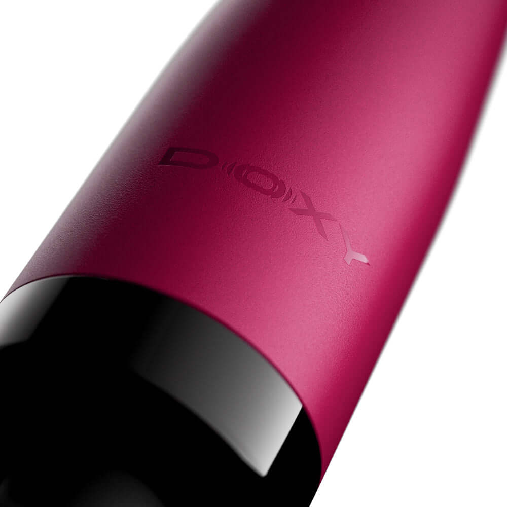 Close-up of the Doxy Original Wand Massager Pink showcasing the sleek design and branding.