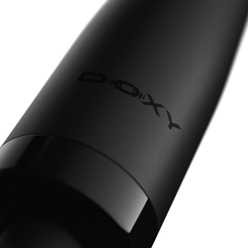 Doxy Die Cast Compact Cordless Wand Massager Black close-up view showcasing sleek design and logo.