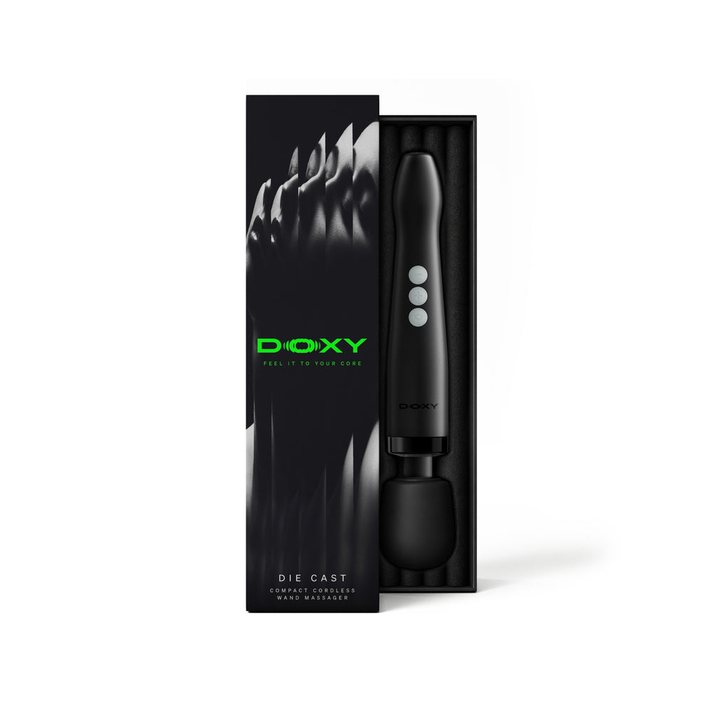 Doxy Die Cast Compact Cordless Wand Massager Black in packaging showcasing its sleek design and features.