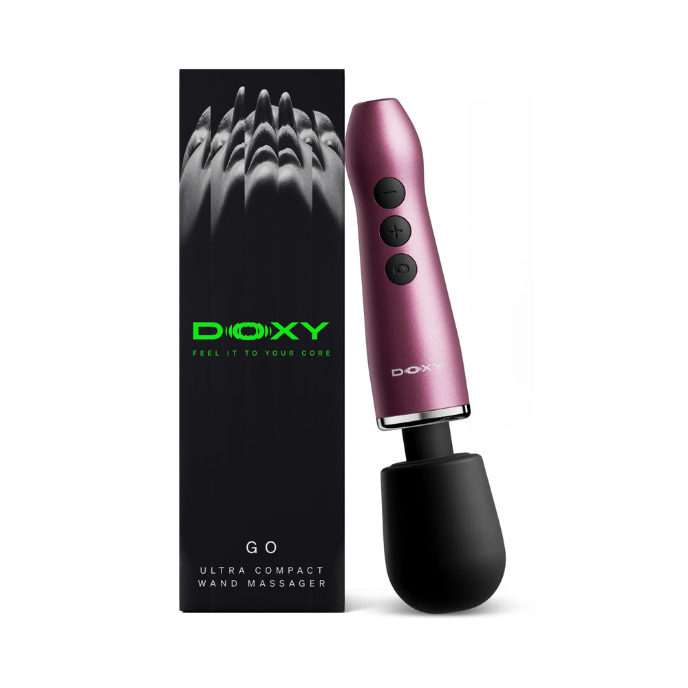 Doxy Go Travel-sized Wand Massager Pink next to its packaging, showcasing its ultra-compact design for travel.